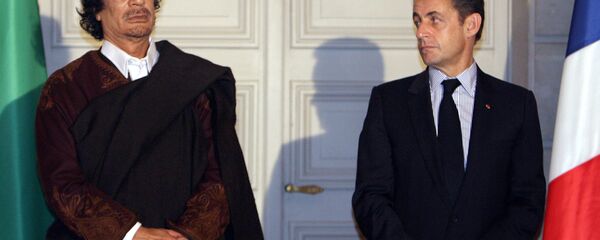 Libyan leader Col. Moammar Gadhafi, left, and French President Nicolas Sarkozy, pose during a signing ceremony at the Elysee Palace, Paris. (File) - Sputnik International