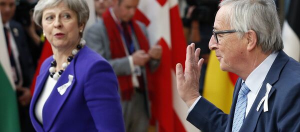 European Commission President Jean-Claude Juncker and Britain's Prime Minister Theresa May arrive at a European Union leaders summit in Brussels, Belgium, March 22, 2018. European Commission President Jean-Claude Juncker and Britain's Prime Minister Theresa May arrive at a European Union leaders summit in Brussels, Belgium, March 22, 2018. - Sputnik International