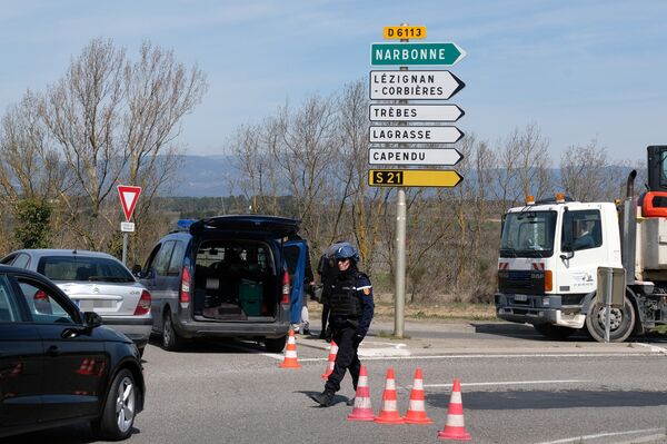 French gendarmes block the access to Trebes, where a man took hostages at a supermarket on March 23, 2018 in Trebes, southwest France French gendarmes block the access to Trebes, where a man took hostages at a supermarket on March 23, 2018 in Trebes, southwest France - Sputnik International