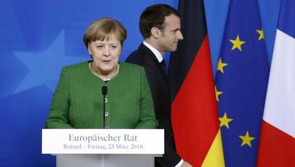 German Chancellor Angela Merkel and France's President Emmanuel Macron hold joint news conference at a European Union leaders summit in Brussels, Belgium - Sputnik International
