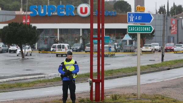 A French gendarme secures the access to a supermarket after a hostage situation in Trebes, France - Sputnik International