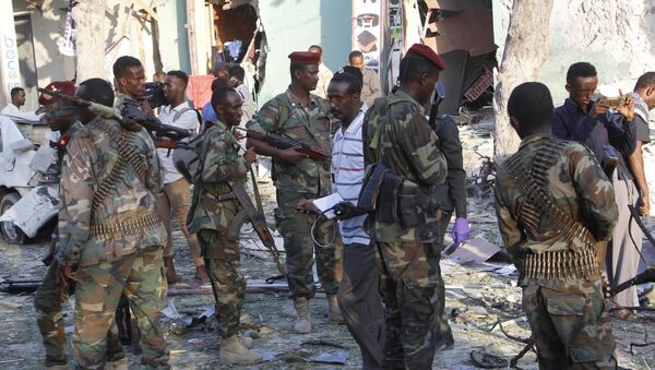 (File) Heavily armed Somalis soldiers seal an area after a car bomb explosion in Mogadishu, Somalia, 22 March 2018 - Sputnik International