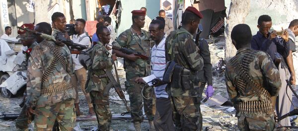 (File) Heavily armed somalis soldiers seal the area after a car bomb exploded in Mogadishu, Somalia Thursday, March 22, 2018 - Sputnik International