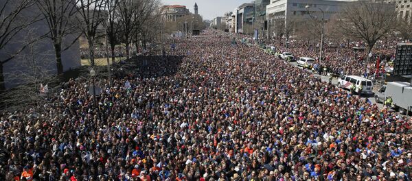 Looking west away from the stage, the crowd fills Pennsylvania Avenue during the March for Our Lives rally in support of gun control, Saturday, March 24, 2018, in Washington. Looking west away from the stage, the crowd fills Pennsylvania Avenue during the March for Our Lives rally in support of gun control, Saturday, March 24, 2018, in Washington. - Sputnik International