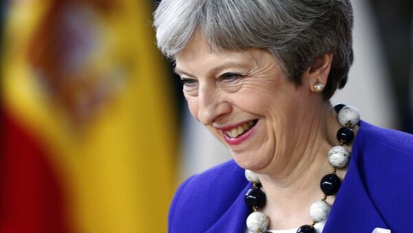 Britain's Prime Minister Theresa May smiles as she arrives at a European Union leaders summit in Brussels, Belgium, March 22, 2018 - Sputnik International