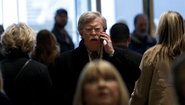 Former U.S. Ambassador to the United Nations John Bolton speaks on a mobile phone as he arrives for a meeting with U.S. President-elect Donald Trump at Trump Tower in New York, U.S., December 2, 2016 - Sputnik International