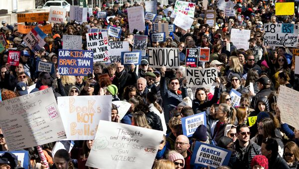 People take part in a march rally against gun violence Saturday, March 24, 2018, in New York - Sputnik International