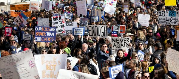 People take part in a march rally against gun violence Saturday, March 24, 2018, in New York - Sputnik International