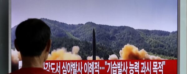 A man watches a TV news program showing a file image of a missile being test-launched by North Korea, at Seoul Railway Station in Seoul, South Korea. (File) A man watches a TV news program showing a file image of a missile being test-launched by North Korea, at Seoul Railway Station in Seoul, South Korea. (File) - Sputnik International