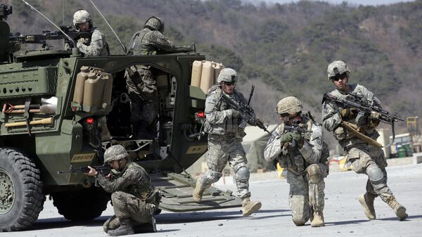 U.S. Army soldiers from the 25th Infantry Division’s 2nd Stryker Brigade Combat Team and South Korean soldiers take their position during a demonstration of the combined arms live-fire exercise as a part of the annual joint military exercise Foal Eagle between South Korea and the United States at the Rodriquez Multi-Purpose Range Complex in Pocheon, north of Seoul, South Korea. (File) - Sputnik International