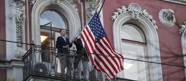 Diplomatic mission personnel remove a US flag from the building of the US Consulate-General on Furshtatskaya Street in St. Petersburg Diplomatic mission personnel remove a US flag from the building of the US Consulate-General on Furshtatskaya Street in St. Petersburg - Sputnik International