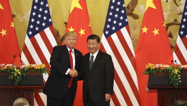U.S. President Donald Trump and Chinese President Xi Jinping shakes hands during a joint press conference at the Great Hall of the People, Thursday, Nov. 9, 2017, in Beijing. (File) - Sputnik International