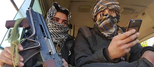 Rebels are seen in a bus as they are evacuated from the town of Douma, eastern Ghouta, in Damascus, Syria April 1, 2018 - Sputnik International