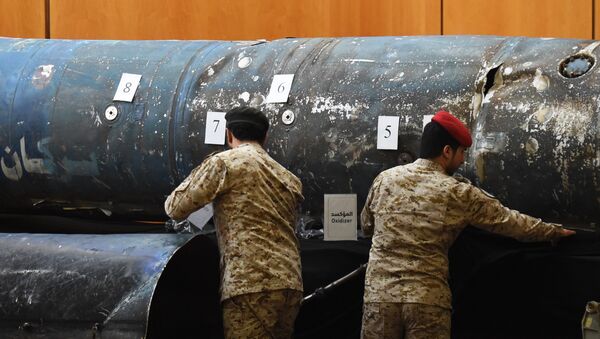 Saudi soldiers reveal the remains of missiles, that a military coalition led by Saudi Arabia claim are Iranian during a press conference at the Armed Forces club in Riyadh on March 26, 2018 - Sputnik International