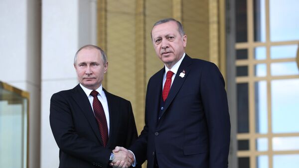 Turkish President Tayyip Erdogan shakes hands with his Russian counterpart Vladimir Putin during a welcoming ceremony at the Presidential Palace in Ankara on April 3, 2018 - Sputnik International