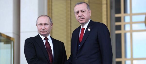 Turkish President Tayyip Erdogan shakes hands with his Russian counterpart Vladimir Putin during a welcoming ceremony at the Presidential Palace in Ankara on April 3, 2018 - Sputnik International