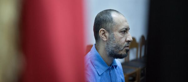 Saadi Muammar Gadhafi, wears a blue jumpsuit behind bars during his trial in the center of Tripoli, Libya, Sunday, Nov. 1, 2015. Saadi Muammar Gadhafi, wears a blue jumpsuit behind bars during his trial in the center of Tripoli, Libya, Sunday, Nov. 1, 2015. - Sputnik International