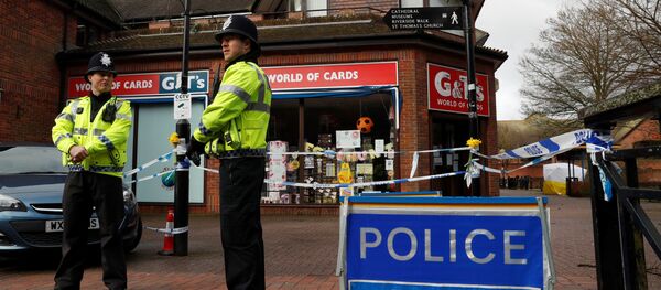 In this file photo taken on March 12, 2018 Police officers stand on duty at a cordon near a bench covered in a protective tent (R) at The Maltings shopping centre in Salisbury, southern England, on where former Russian spy Sergei Skripal and his daughter Yulia were found critically ill on a bench on March 4 and taken to hospital sparking a major incident In this file photo taken on March 12, 2018 Police officers stand on duty at a cordon near a bench covered in a protective tent (R) at The Maltings shopping centre in Salisbury, southern England, on where former Russian spy Sergei Skripal and his daughter Yulia were found critically ill on a bench on March 4 and taken to hospital sparking a major incident - Sputnik International
