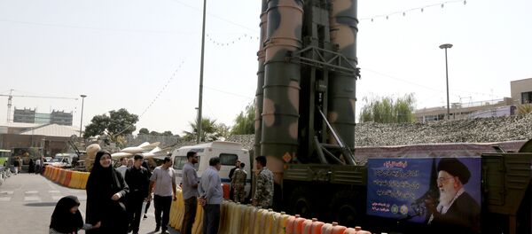 People walk past a Russian-made S-300 air defence system displayed on Baharestan square in Tehran on September 25, 2017 People walk past a Russian-made S-300 air defence system displayed on Baharestan square in Tehran on September 25, 2017 - Sputnik International