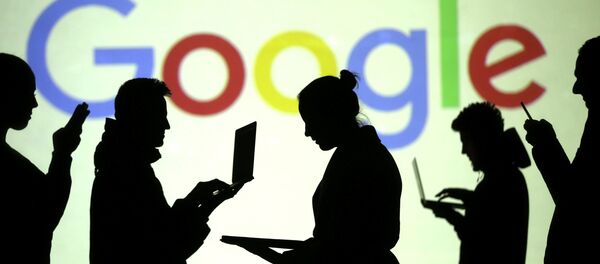 Silhouettes of laptop and mobile device users are seen next to a screen projection of Google logo in this picture illustration taken March 28, 2018 - Sputnik International