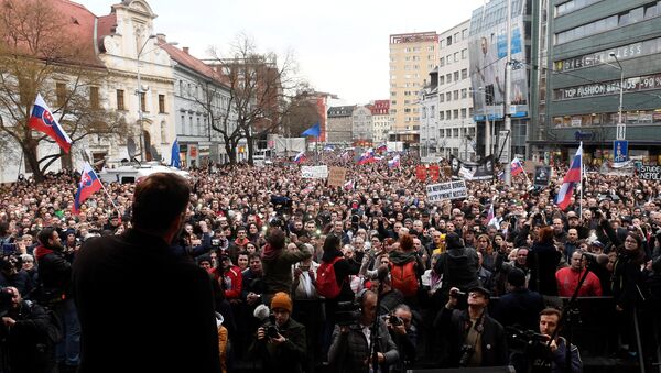 People attend a protest rally in reaction to the murder of Slovak investigative reporter Jan Kuciak and his fiancee Martina Kusnirova, in Bratislava, Slovakia April 5, 2018 - Sputnik International