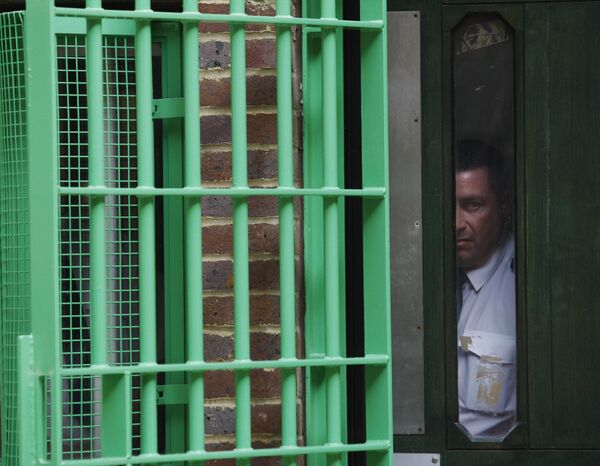 Under the watchful eye of prison security personnel, Britain's Prince Charles, not seen, tours Belmarsh prison, in southeast London, Thursday Sept. 10, 2009. - Sputnik International