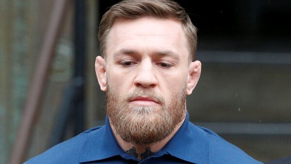 Mixed Martial Arts fighter Conor McGregor is escorted by New York City Police (NYPD) detectives from the 78th police precinct after charges were laid against him in the Brooklyn borough of New York City, U.S., April 6, 2018 - Sputnik International