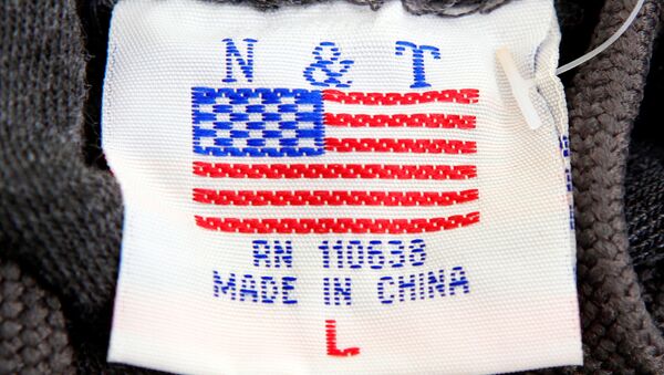 The label of a Washington D.C. sweatshirt bears a U.S. flag but says Made in China at a souvenir stand in Washington, DC, U.S., January 14, 2011 - Sputnik International