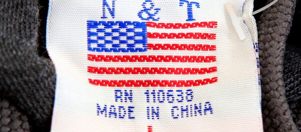 The label of a Washington D.C. sweatshirt bears a U.S. flag but says Made in China at a souvenir stand in Washington, DC, U.S., January 14, 2011 The label of a Washington D.C. sweatshirt bears a U.S. flag but says Made in China at a souvenir stand in Washington, DC, U.S., January 14, 2011 - Sputnik International