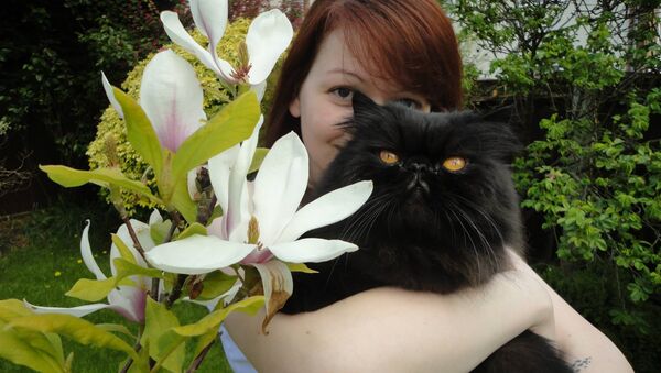 Yulia Skripal poses with a cat. File photo - Sputnik International