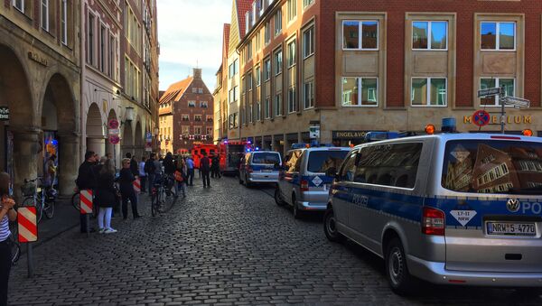First responders work at the scene when several people were killed and injured when a car ploughed into pedestrians in Muenster, western Germany on April 7, 2018 - Sputnik International