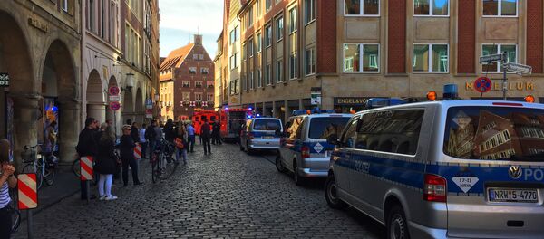 First responders work at the scene when several people were killed and injured when a car ploughed into pedestrians in Muenster, western Germany on April 7, 2018 - Sputnik International