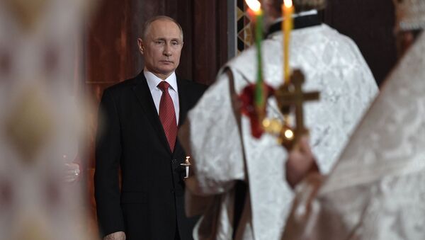 April 7, 2017. Russian President Vladimir Putin during the Easter service at the Christ the Savior Cathedral in Moscow - Sputnik International