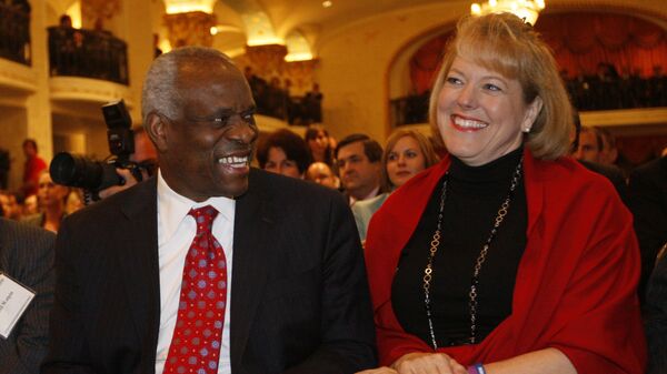 FILE - In this Nov. 15, 2007, photo, Supreme Court Justice Clarence Thomas, left, sits with his wife Virginia Thomas, as he is introduced at the Federalist Society in Washington, where he spoke about his new book and took questions from the audience. - Sputnik International