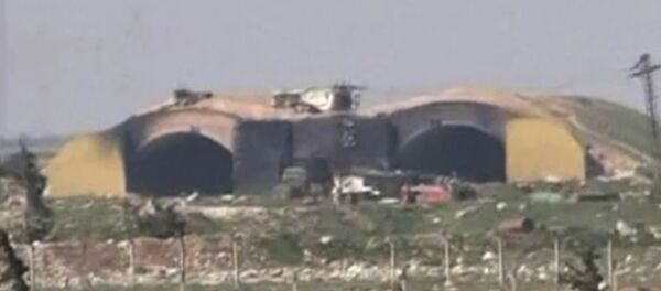 This frame grab from video provided by the Syrian official TV, a Syrian government channel that is consistent with independent AP reporting, shows the burned and damaged hangar warplanes which attacked by U.S. Tomahawk missiles, at the Shayrat Syrian government forces airbase, southeast of Homs, Syria, early Friday April, 7, 2017 This frame grab from video provided by the Syrian official TV, a Syrian government channel that is consistent with independent AP reporting, shows the burned and damaged hangar warplanes which attacked by U.S. Tomahawk missiles, at the Shayrat Syrian government forces airbase, southeast of Homs, Syria, early Friday April, 7, 2017 - Sputnik International