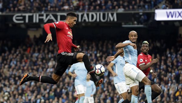 Manchester United's Chris Smalling, left, scores his side's third goal during the English Premier League soccer match between Manchester City and Manchester United at the Etihad Stadium in Manchester, England, Saturday April 7, 2018 - Sputnik International