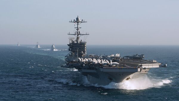 The aircraft carrier group of the United States Navy led by USS Harry S. Truman, front, and a ship escort are seen leaving the port of Norfolk heading for the Middle East - Sputnik International