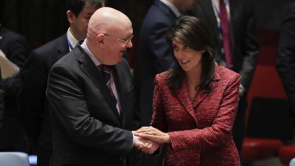 Russian Ambassador to the United Nations Vasily Nebenzya, left, and United States Ambassador to the U.N. Nikki Haley shake hands before a Security Council meeting, Tuesday, April 10, 2018, at U.N. headquarters - Sputnik International