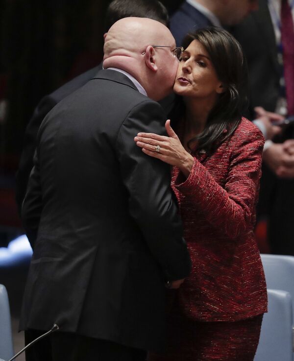 Russian Ambassador to the United Nations Vasily Nebenzya, left, and United States Ambassador to the U.N. Nikki Haley exchange greetings before a Security Council meeting, Tuesday, April 10, 2018, at U.N. headquarters Russian Ambassador to the United Nations Vasily Nebenzya, left, and United States Ambassador to the U.N. Nikki Haley exchange greetings before a Security Council meeting, Tuesday, April 10, 2018, at U.N. headquarters - Sputnik International