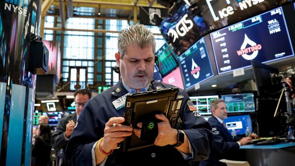 The Dow Jones Industrial average is displayed on a screen after the closing bell at the New York Stock Exchange, (NYSE) in New York, U.S., April 10, 2018 - Sputnik International