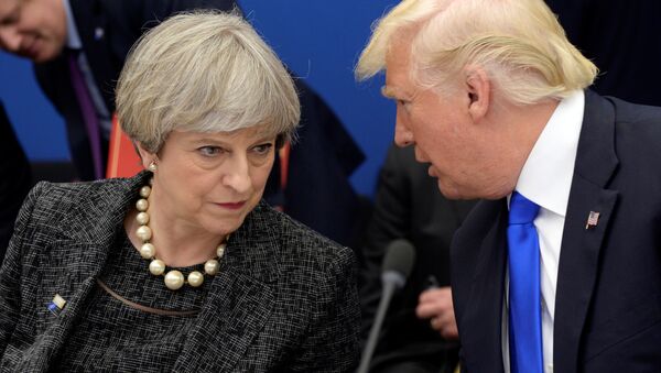 US President Donald Trump, right, speaks to British Prime Minister Theresa May in a working dinner meeting during the NATO summit of heads of state and government at the NATO headquarters, in Brussels on Thursday, May 25, 2017. - Sputnik International