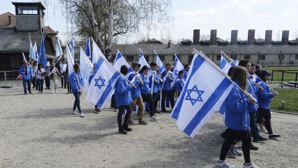 People take part in the annual March of the Living to commemorate the Holocaust, a yearly Holocaust remembrance march between the former death camps of Auschwitz and Birkenau, in Oswiecim, Poland - Sputnik International