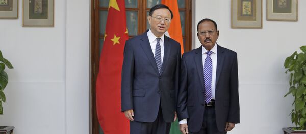 Indian National Security Adviser Ajit Doval, right, poses with Chinese State Councillor Yang Jiechi for photos before their meeting in New Delhi, India. (File) Indian National Security Adviser Ajit Doval, right, poses with Chinese State Councillor Yang Jiechi for photos before their meeting in New Delhi, India. (File) - Sputnik International