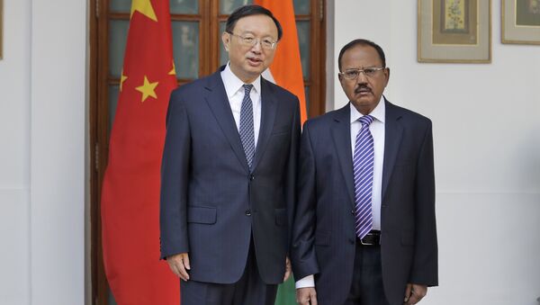 Indian National Security Adviser Ajit Doval, right, poses with Chinese State Councillor Yang Jiechi for photos before their meeting in New Delhi, India. (File) - Sputnik International