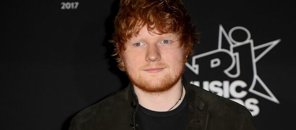 British singer and songwriter Edward Christopher Sheeran aka Ed Sheeran, poses upon his arrival to attend the 19th NRJ Music Awards at the Palais des Festivals, in Cannes, southeastern France. (File) British singer and songwriter Edward Christopher Sheeran aka Ed Sheeran, poses upon his arrival to attend the 19th NRJ Music Awards at the Palais des Festivals, in Cannes, southeastern France. (File) - Sputnik International