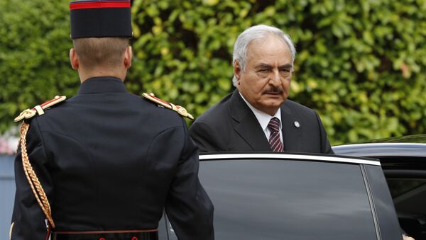 General Khalifa Haftar, commander in the Libyan National Army (LNA), arrives to attend a meeting for talks over a political deal to help end Libya’s crisis in La Celle-Saint-Cloud near Paris, France. (File) - Sputnik International