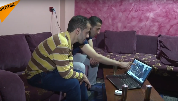 Douma witnesses watch Douma provocation video. - Sputnik International
