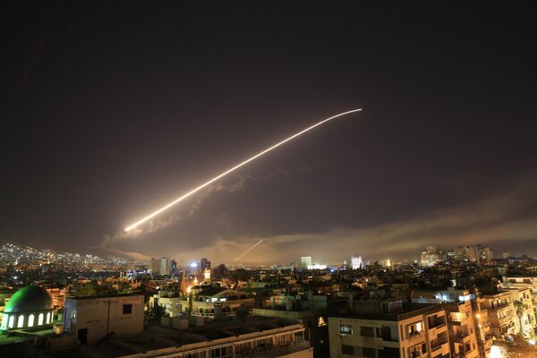 Damascus sky lights up with service to air missile fire as the U.S. launches an attack on Syria targeting different parts of the Syrian capital Damascus, Syria, early Saturday, April 14, 2018. Damascus sky lights up with service to air missile fire as the U.S. launches an attack on Syria targeting different parts of the Syrian capital Damascus, Syria, early Saturday, April 14, 2018. - Sputnik International