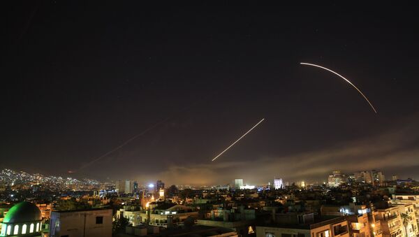 Missiles streak across the Damascus skyline amid the April 2018 US attack on Syria. - Sputnik International