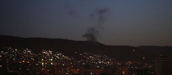 Smoke rises after airstrikes targeting different parts of the Syrian capital Damascus, Syria, early Saturday, April 14, 2018 - Sputnik International